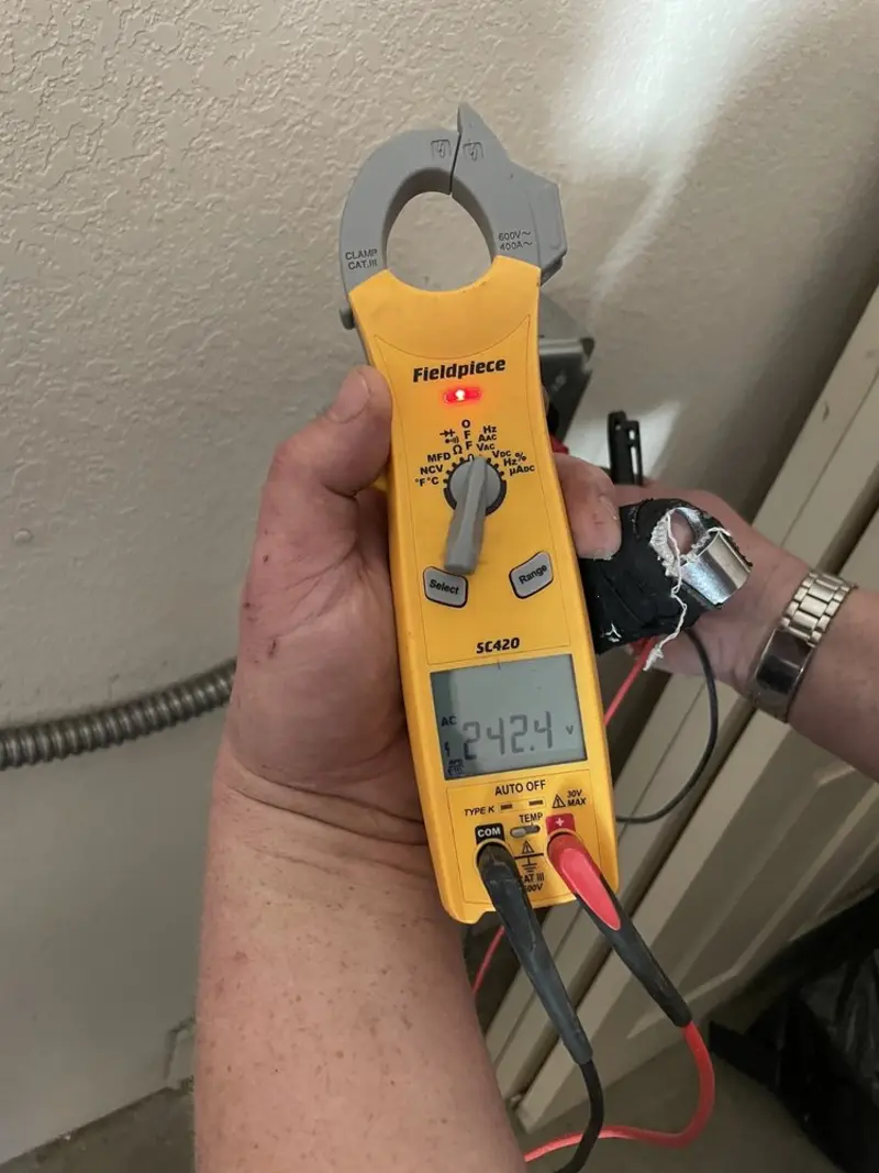 Voltage testing with clamp meter during Generator Installation in Litchfield